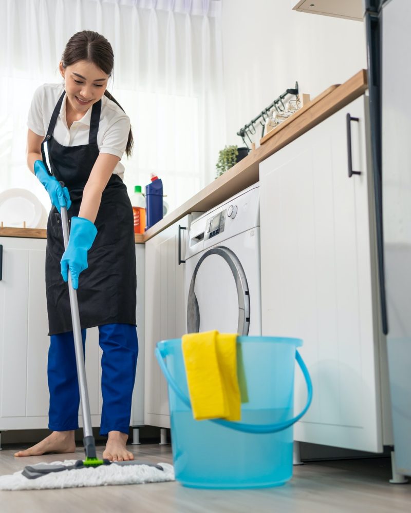 ASIAN ACTIVE CLEANING SERVICE WOMAN WORKER CLEANING FEEL HAPPY IN KITCHEN AT HOME  - THOGA SPARKLE SOLUTIONS BALI